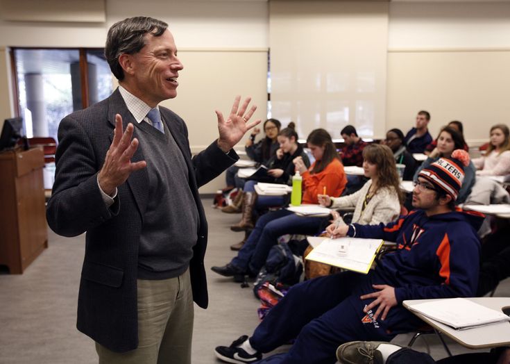 Academic leader teaching students in classroom